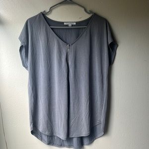 Gray top with the V-neck and Zipper detail on front